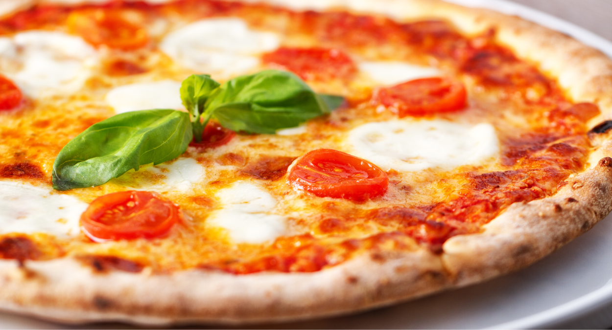Qual é a origem da pizza? (imagem: Canva)